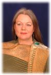 Ann heymann wih her gold-strung replica medieval harp